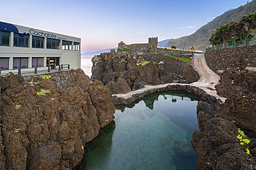 Elevated view natural volcanic rock pools near Aquarium of Madeira (Aquario da Madeira) and Cachalote restaurant, Porto Moniz, Madeira, Portugal, Atlantic, Europe