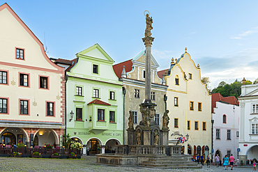 Fountain and Plague Column at Namesti Svornosti square in historic center of Cesky Krumlov, UNESCO World Heritage Site, South Bohemian Region, Czech Republic (Czechia), Europe