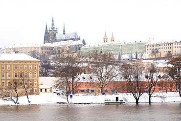 Prague Castle by Vltava river with snow in winter, Prague, Czech Republic