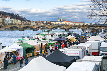 Farmers market on Vltava riverside near Palackeho namesti and Prague Castle in background, Prague, Czech Republic (Czechia), Europe