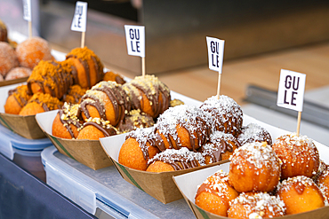 Paper trays with sweet pastry on display at farmers market on Vltava riverside near Palackeho namesti, Prague, Czech Republic (Czechia), Europe