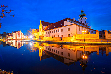 Dominican Monastery reflecting in Malse river at twilight, Ceske Budejovice, South Bohemian Region, Czech Republic