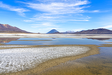 Reflection pool on salt flats and distant views of El Misti and Chachani volcanoes, Salinas y Aguada Blanca National Reserve, Arequipa Province, Arequipa Region, Peru, South America