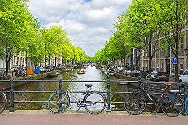 Bicycles on bridge over Herengracht canal, Amsterdam, The Netherlands