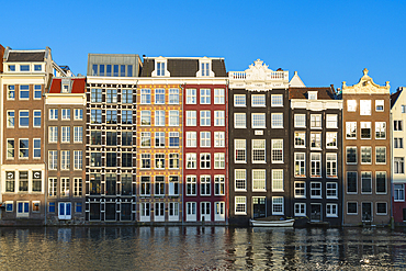 Dancing houses at Damrak at sunset, Amsterdam, The Netherlands