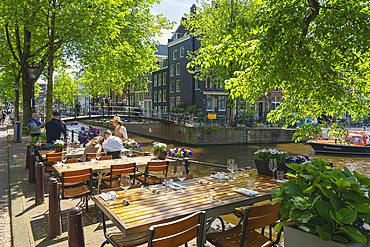 Restaurant tables by Brouwersgracht canal, Amsterdam, The Netherlands