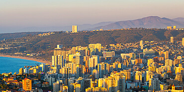 Elevated view of Vina del Mar coastal city at sunset seen from Mirador Pablo Neruda, Vina del Mar, Chile