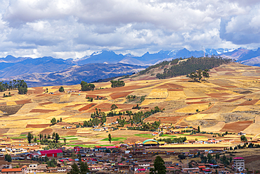 Fields around Racchi village near Chinchero with distant views of Andes mountains, Sacred Valley, Peru, South America