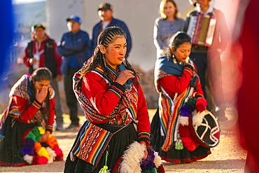 Peruvian women in traditional dresses on celebration, Chinchero, Peru