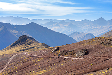 Motocycle on mountain road in Andean mountains near Rainbow mountain, Pitumarca District, Cuzco Region, Peru, South America