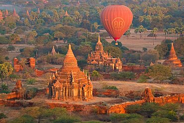 Old temple in Bagan and hot-air balloons before sunrise, UNESCO, Old Bagan, Myanmar