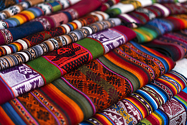 Fabrics at market, Pisaq, Sacred Valley, Cusco, Peru, South America