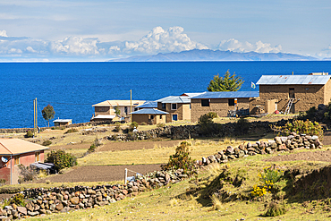 Houses with fields on Amantani island, Lake Titicaca, Puno, Peru, South America