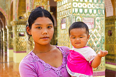 Young Burmese woman holding her small boy and looking at camera, Mandalay Hill, Mandalay, Myanmar (Burma), Asia