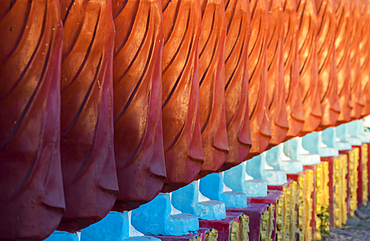 Close-up of monk sculptures standing in line at Myo Yar Pyae Pagoda, Monywa, Myanmar (Burma), Asia