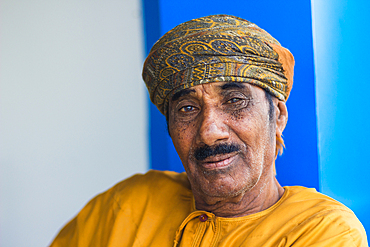 Portrait of older Omani man with headwear looking at camera, Wadi Tiwi, Oman, Middle East