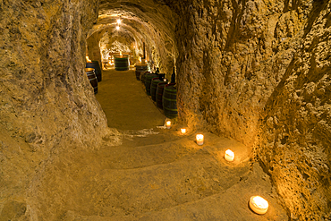 Interior of old wine cellar lit by candles, Vrbice, Breclav District, Moravia, Czech Republic (Czechia), Europe