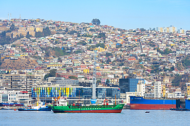 Ship near Port of Valparaiso with city in background, Valparaiso, Valparaiso Province, Valparaiso Region, Chile, South America