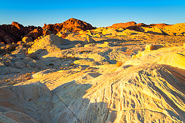 Red and white rock formations at Fire Canyon and Silica Dome at sunrise, Valley of Fire State Park, Nevada, Western United States, USA