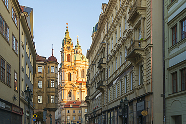 Illuminated St. Nicholas Church at sunrise, Mala Strana, Prague, Bohemia, Czech Republic (Czechia), Europe