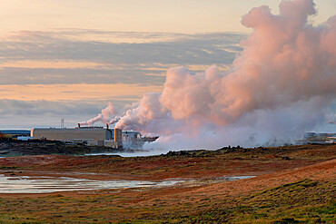 Geothermal Reykjanes power plant and smoking fumarole at Gunnuhver hot spring, Reykjanes Peninsula, Iceland