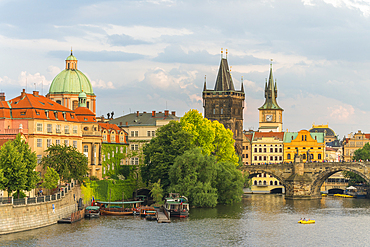 Charles Bridge and Church of Saint Francis of Assisi with Old Town Bridge Tower against sky, UNESCO World Heritage Site, Prague, Bohemia, Czech Republic (Czechia), Europe