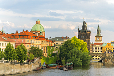 Charles Bridge and Church of Saint Francis of Assisi with Old Town Bridge Tower against sky, UNESCO World Heritage Site, Prague, Bohemia, Czech Republic (Czechia), Europe