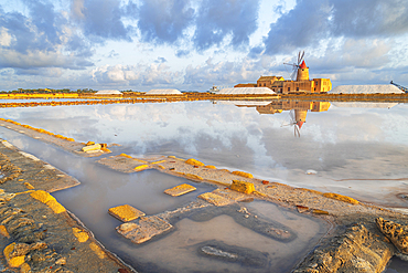 Reflection of the windmill in the salt flats at dawn, Saline Ettore e Infersa, Marsala, province of Trapani, Sicily, Italy, Mediterranean, Europe