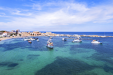 Aerial view of the harbour of the fishing village of Marzamemi with fishing boats floating in turquoise waters, Marzamemi, Pachino municipality, Siracusa province, Sicily,  Italy, Mediterranean, Europe