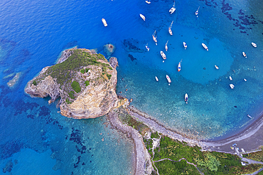 Aerial view of the cliff of Saint Silverio with boats anchored in Francese Bay, Palmarola island, Ponza municipality, Tyrrhenian Sea, Pontine archipelago, Latina Province, Latium (Lazio), Italy, Europe