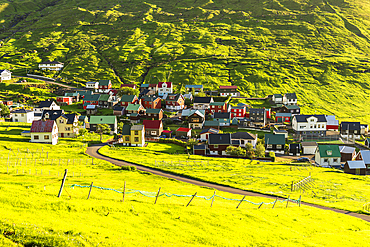 The colorful houses of the fishing village of Funningur at sunrise, Eysturoy island, Faroe islands, Denmark, Europe