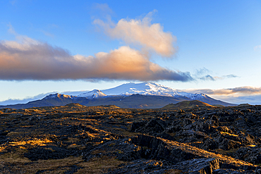 Snaefellsjokull glacier covering the Snaefell volcano seen at sunset with pink clouds and blue sky, Snaefellsnes Peninsula, West Iceland, Iceland, Polar Regions