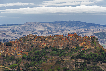 The small wonderful town of Calascibetta on top of a rocky hill in the Sicilian countryside, Enna province, Sicily, Italy, Mediterranean, Europe