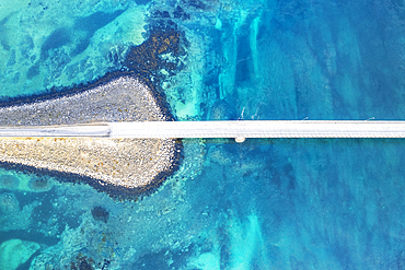 Aerial view of the bridge linking islands crossing the fjord with turquoise Arctic water, Flakstadburene, Fredvang, Lofoten Islands, Norway, Scandinavia, Europe