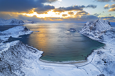 Winter aerial view of a beach covered with snow at sunset, Vik beach, Vestvagoy, Lofoten Islands, Norway, Scandinavia, Europe