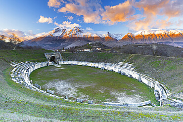 Sunset from the amphitheatre of the Roman site of Alba Fucens with snow covered mountains, L'Aquila province, Abruzzo, Italy, Europe