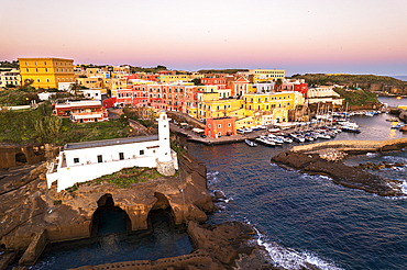 Lighthouse and the colourful village of Ventotene at dawn, Pontine Islands, Tyrrhenian Sea, Latina province, Lazio, Italy, Europe