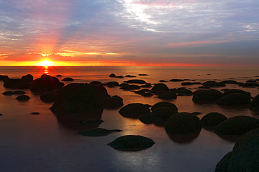 Midsummer sunset over The Wash from the beach at Hunstanton, north Norfolk, England, United Kingdom, Europe