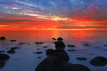 Midsummer sunset over The Wash, from Hunstanton beach, North Norfolk, England, United Kingdom, Europe