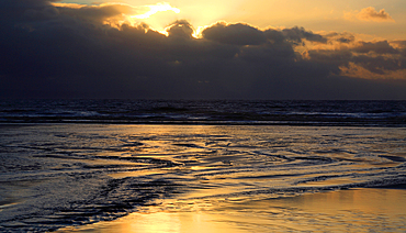 Sunset over the beach from Dunraven Bay, Southerndown, Vale of Glamorgan, South Wales, United Kingdom