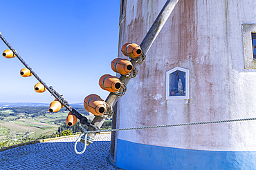 Europe, Portugal, Moita dos Ferreiros. Clay pots, known as buzio, on a traditional windmill. The sound of the wind in the buzio help the miller control the mill.