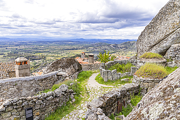 Europe, Portugal, Monsanto. Pathway with stone walls winding through boulders.