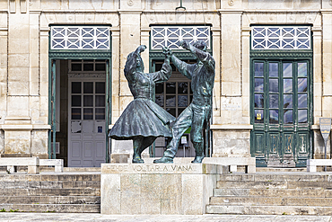 Europe, Portugal, Viana do Castelo. April 10, 2022. Statue of two dancers outside the train station, with test saying, "I'll go back to Viana."