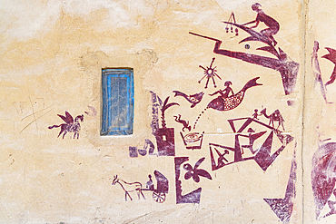 Faiyum, Egypt. February 2, 2022. Blue window and mural on a bulding in Faiyum.