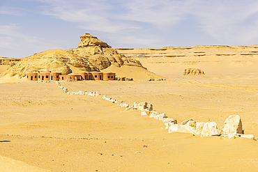 Wadi al Hitan, Faiyum, Egypt. February 20, 2022. Smalls building and stone wall at Wadi el-Hitan paleontological site.