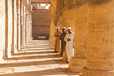 Agilkia Island, Aswan, Egypt. February 24, 2022. Guides between columns at Philae Temple, a UNESCO World Heritage Site.