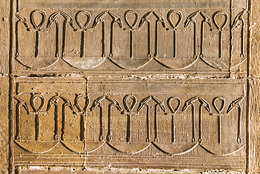 Edfu, Aswan, Egypt. February 25, 2022. Decorative pattern with ankhs in the Temple of Horus at Edfu.