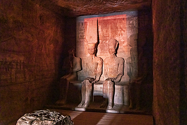 Abu Simbel, Aswan, Egypt. February 23, 2022. Sunrise light on statues of Ptah, Amun, Ramesses II, and Ra in the Holiest of Holies in the Great Temple of Ramesses II.