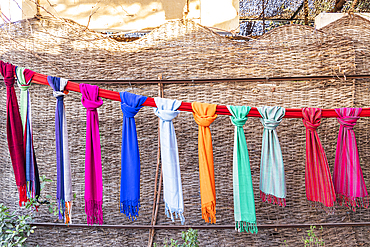 Thebes, Luxor, Egypt. Colorful scarves hanging on a line in Luxor.