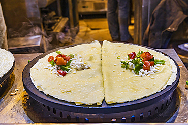 Cairo, Egypt. Crepes being made at a shop on El Moez street in Old Cairo.